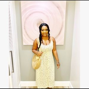 Knee-length spaghetti strap dress.